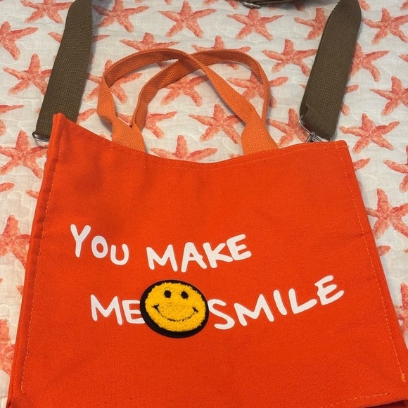 hoodies for heros Handbags - Orange Tote Bag with Smile Design